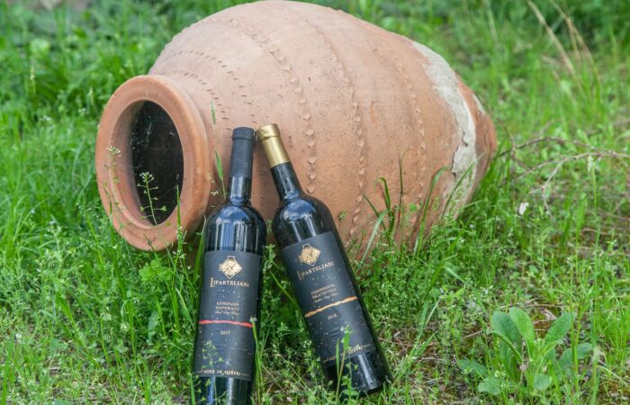 Wine bottles and qvevri in Bolnisi