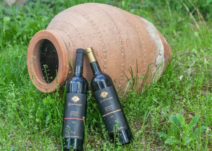 Wine bottles and qvevri in Bolnisi