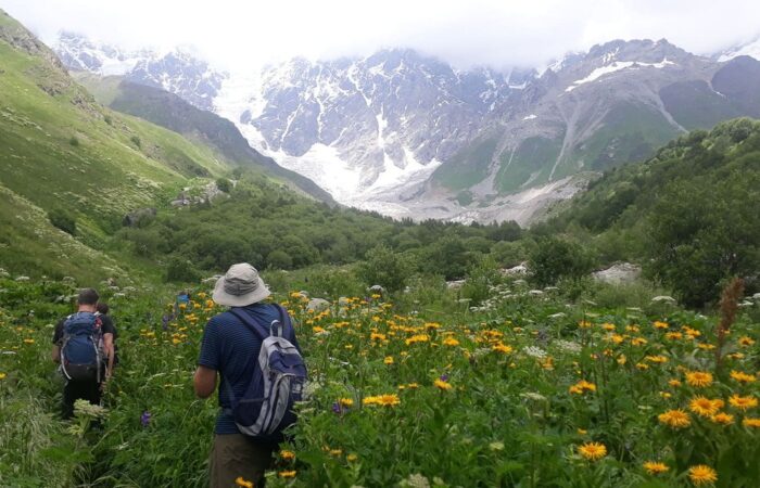 A tourist in the Shkhara Valley hiking from Mestia to Ushguli